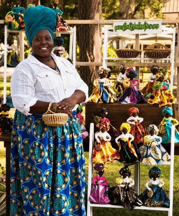 Ms Gina Watson Gullah Artist & Gullah Doll Maker showcasing a collection of handmade Gullah Dolls